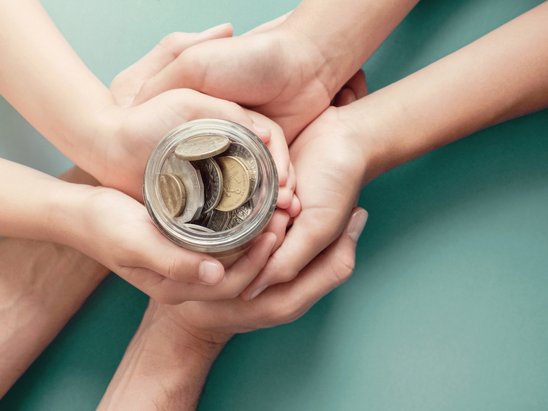 child and parent hands holding money jar, donation, saving, charity, family finance plan concept, Coronavirus economic stimulus rescue package, superannuation concept