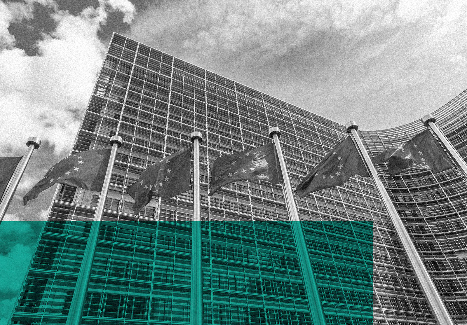 European flags in front of headquarters of European commission in Brussels in summer day