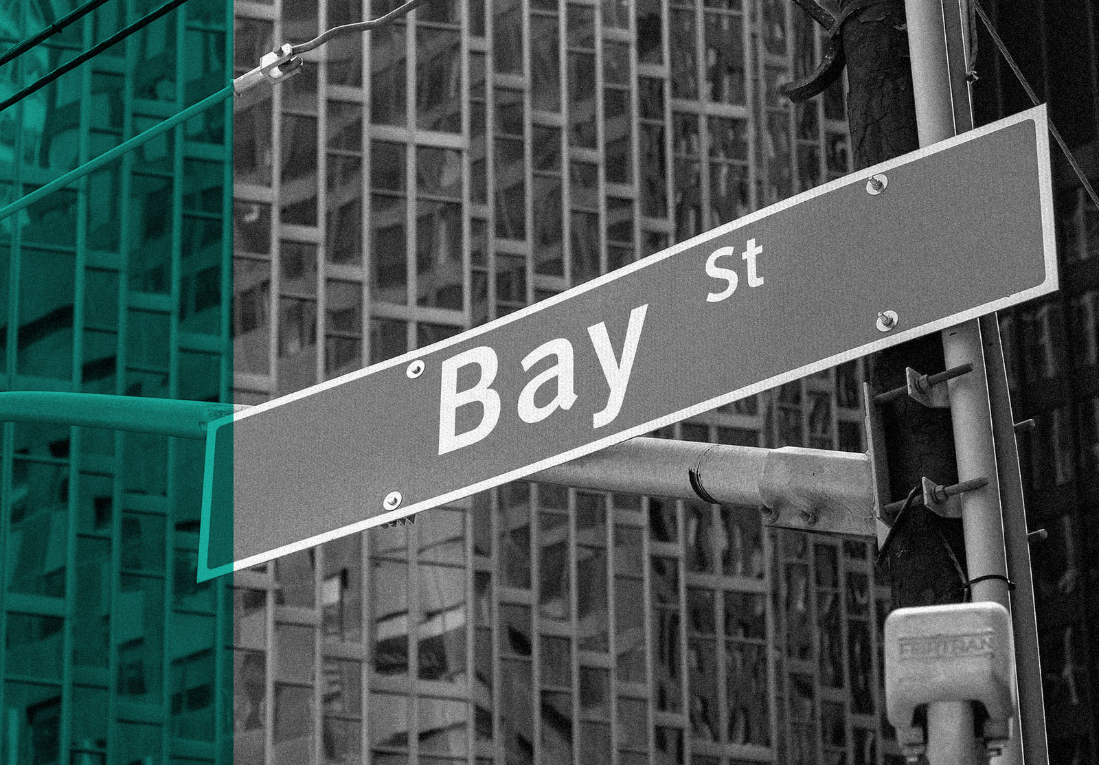 Bay Street sign with glass wall of a bank building in background