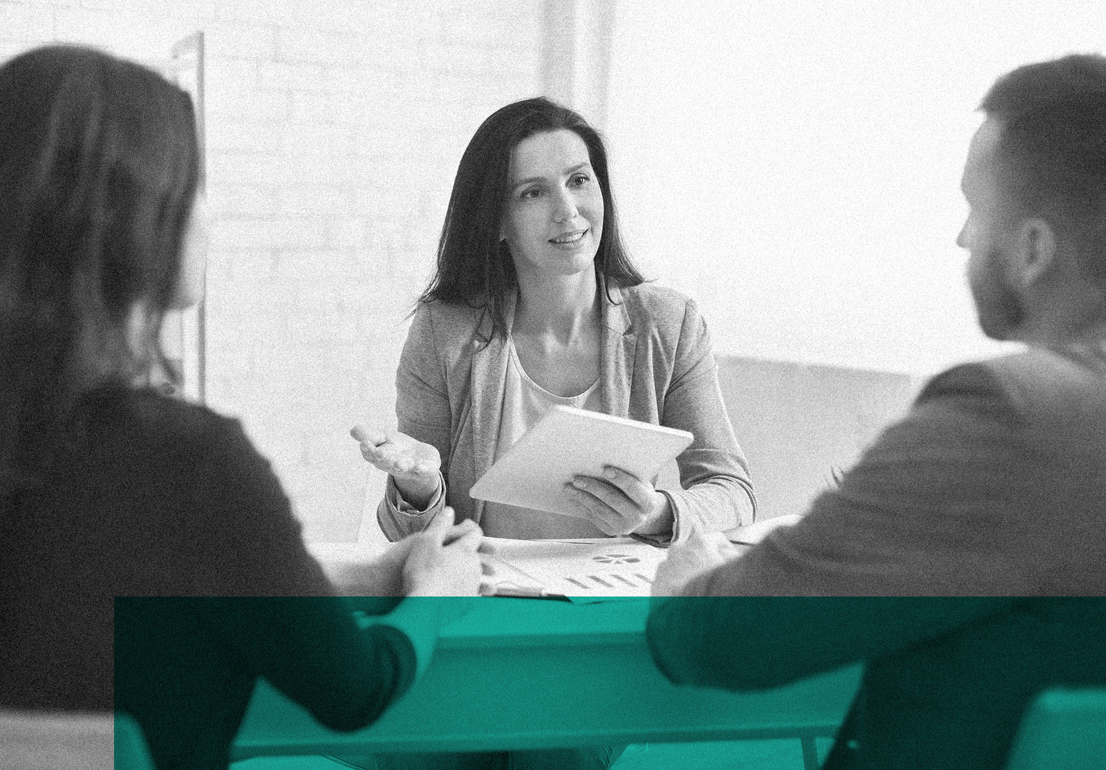 Professional woman talking to young couple at meeting