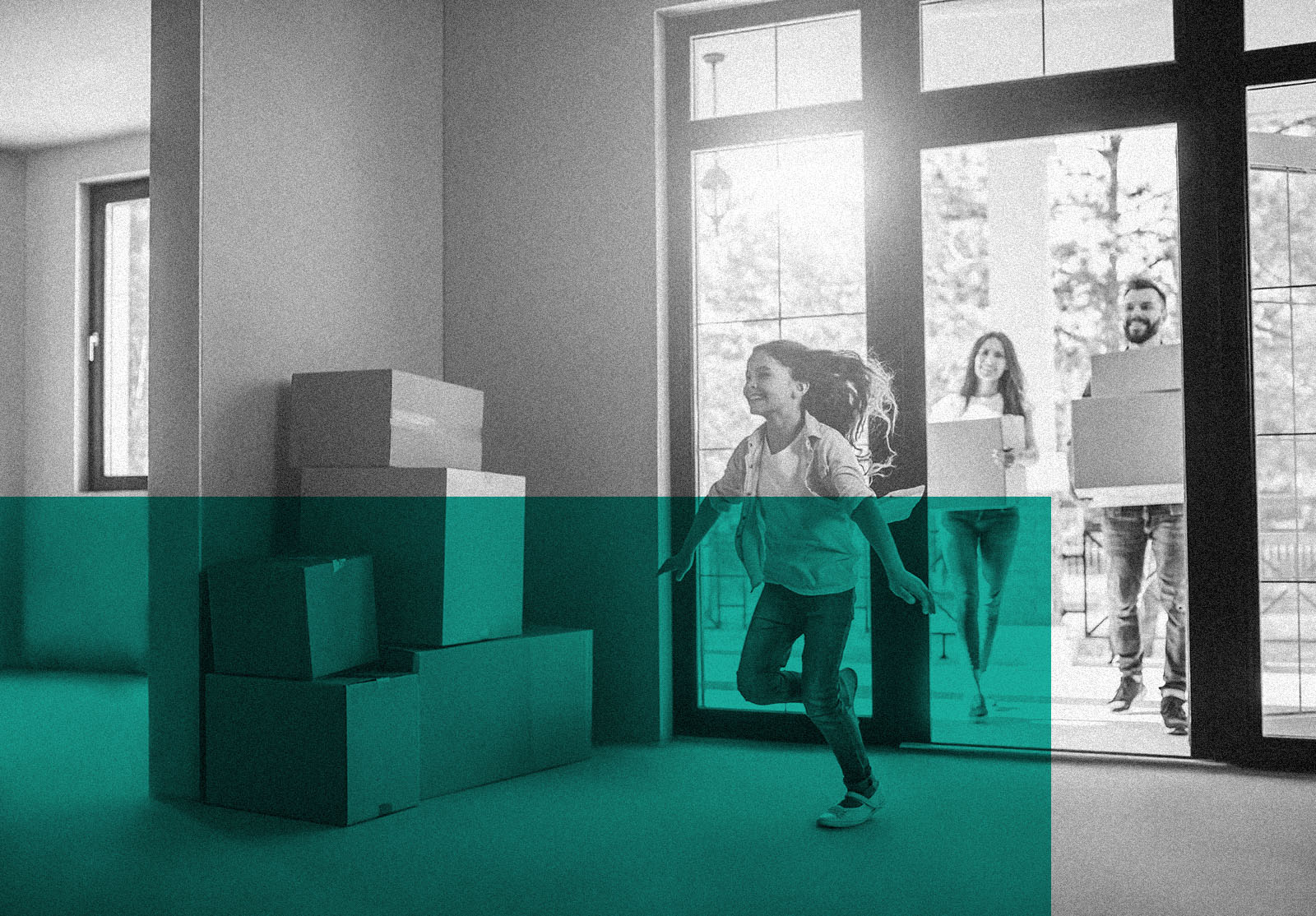 Happy family with cardboard boxes in new house at moving day.